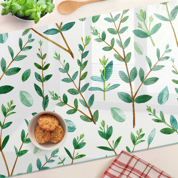 Schneidebrett mit grünem Blatt- und Zweigmotiv