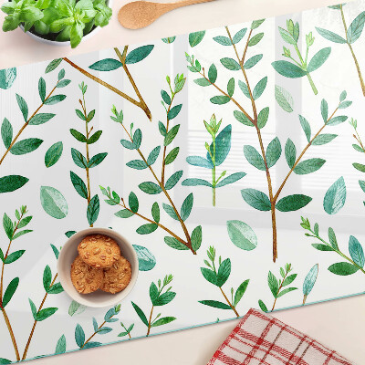 Schneidebrett mit grünem Blatt- und Zweigmotiv