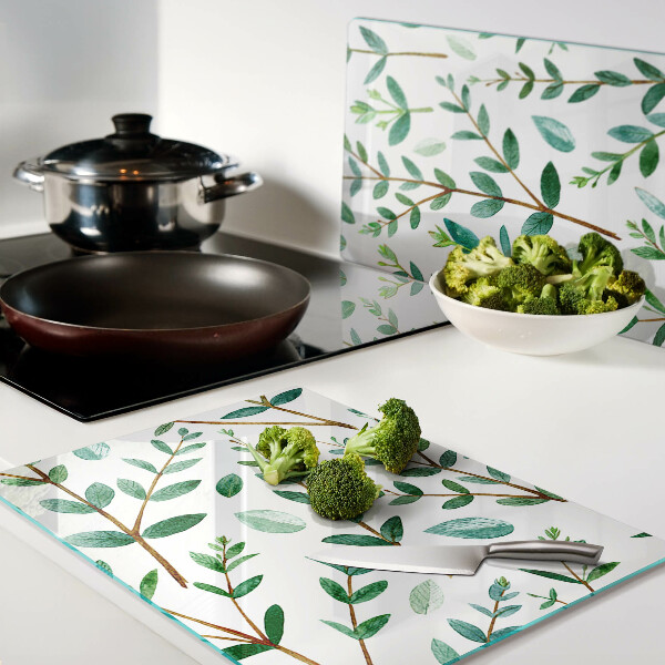 Schneidebrett mit grünem Blatt- und Zweigmotiv