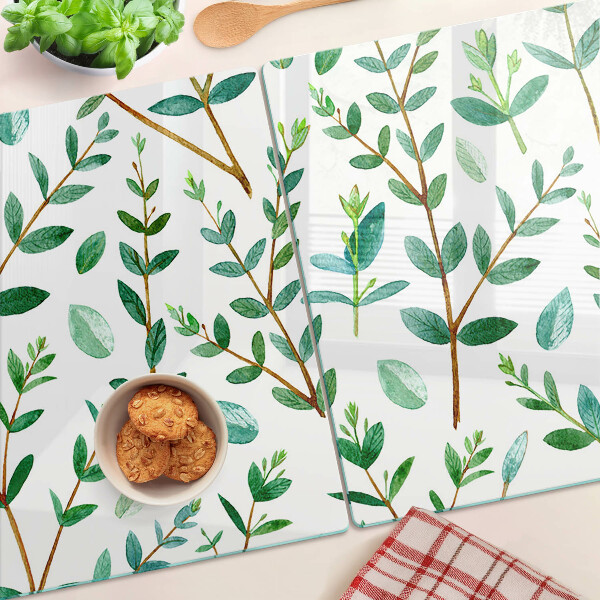 Schneidebrett mit grünem Blatt- und Zweigmotiv