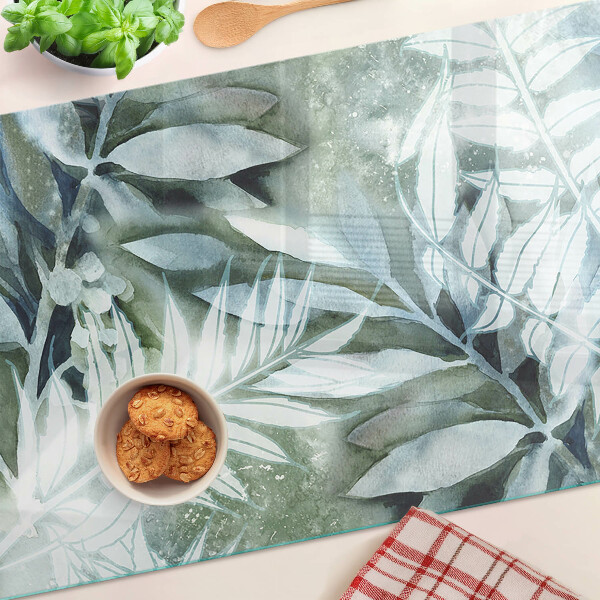 Glas-Schneidebrett mit Motiv tropischer Blätter in Pastelltönen