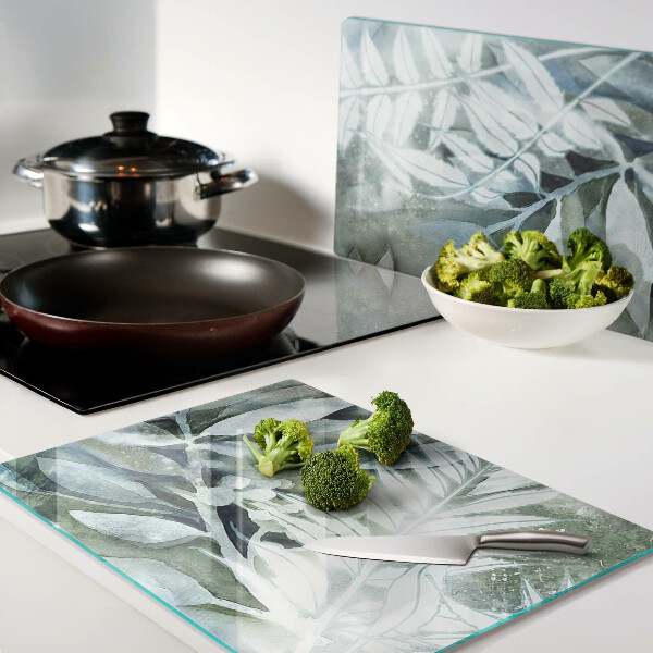 Glas-Schneidebrett mit Motiv tropischer Blätter in Pastelltönen