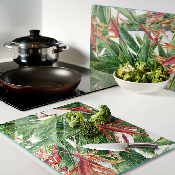 Schneidebrett Glas mit Motiv aus tropischen Blättern und Blüten