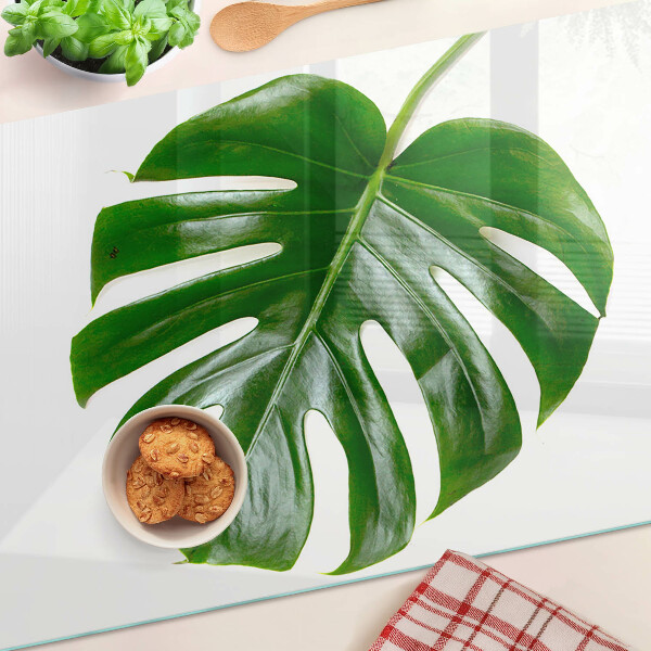 Glas Schneidebrett mit Monstera-Blättern
