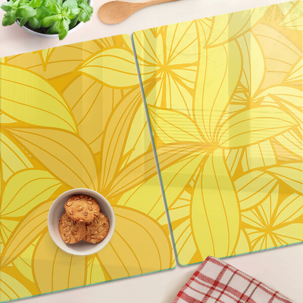 Glas-Schneidebrett mit gelbem tropischem Blattmotiv
