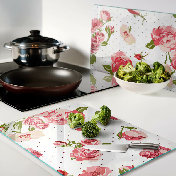 Glas-Schneidebrett mit Rosendekor auf weißem Hintergrund