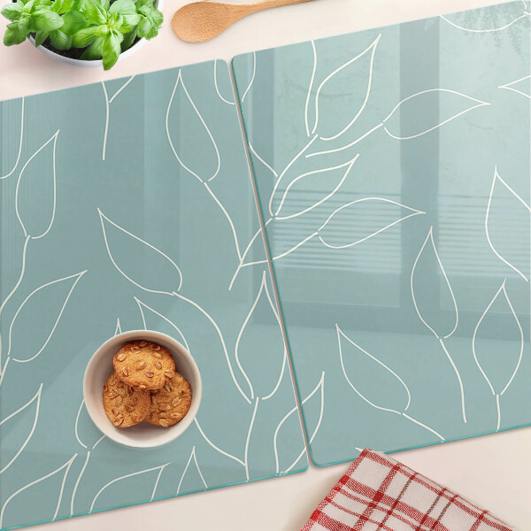 Schneidebrett glas Blätter im Hintergrund