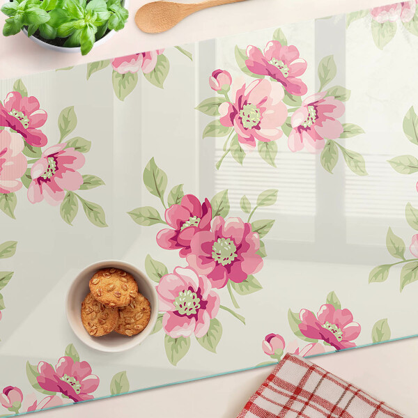 Glas-Schneidebrett mit Blumenmuster in Rosatönen