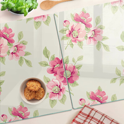 Glas-Schneidebrett mit Blumenmuster in Rosatönen