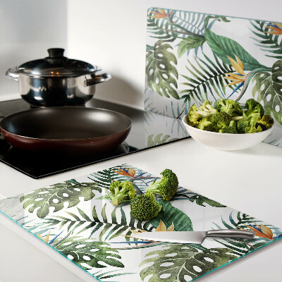 Schneidebrett Glas mit tropischen Blättern und Blüten als Dekor