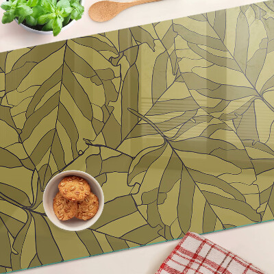 Schneidebrett mit Blattmotiv in Goldtönen