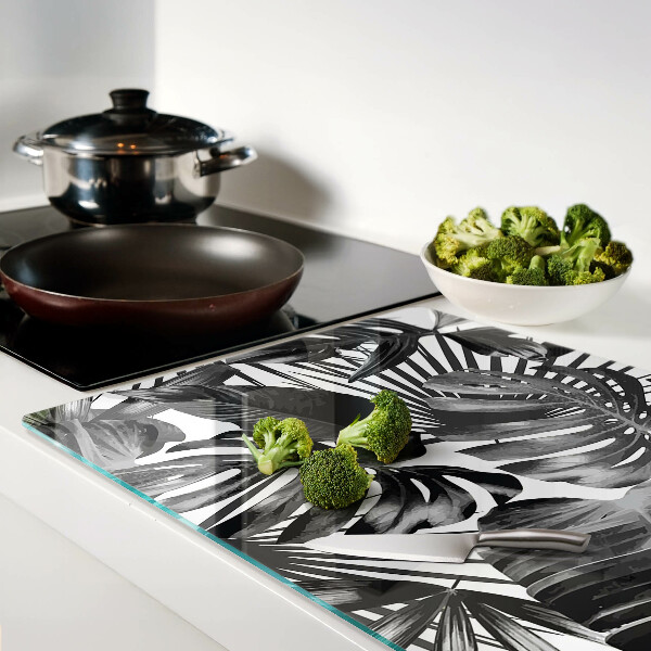 Glas-Schneidebrett mit tropischen Blättern in Schwarzweiß