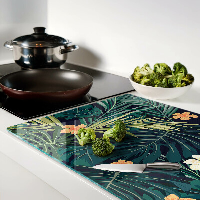 Schneidebrett mit tropischem Muster aus Blättern und Blüten