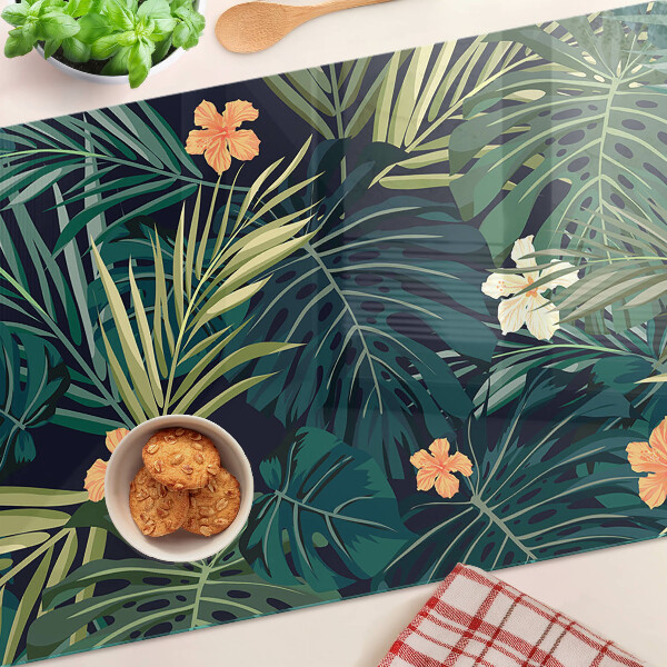 Schneidebrett mit tropischem Muster aus Blättern und Blüten