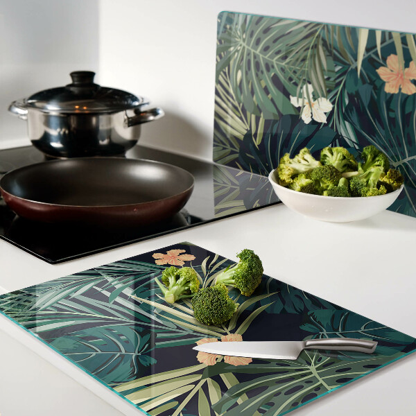 Schneidebrett mit tropischem Muster aus Blättern und Blüten