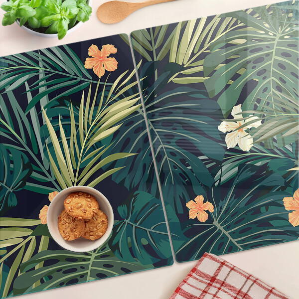 Schneidebrett mit tropischem Muster aus Blättern und Blüten