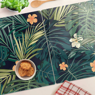 Schneidebrett mit tropischem Muster aus Blättern und Blüten