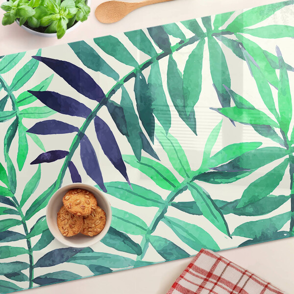 Glas-Schneidebrett mit Palmenblättern im Aquarellstil