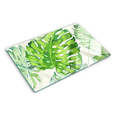 Schneidebrett Monstera-Blätter auf hellem Hintergrund