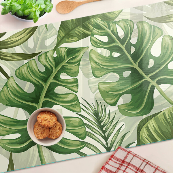 Schneidebrett mit Motiv tropischer Blätter
