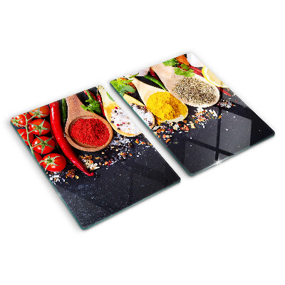 Schneidebrett mit Motiv aus Gewürzen und Kräutern