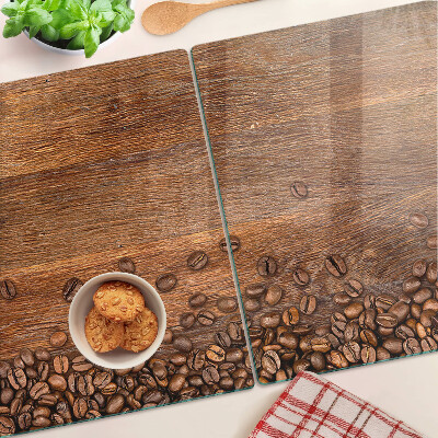 Glas Schneidebrett mit Motiv aus Kaffeebohnen auf Holzmaserung