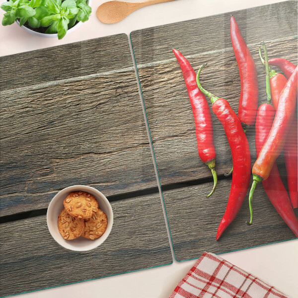 Schneidebrett glas Chilischoten auf Holzgrund