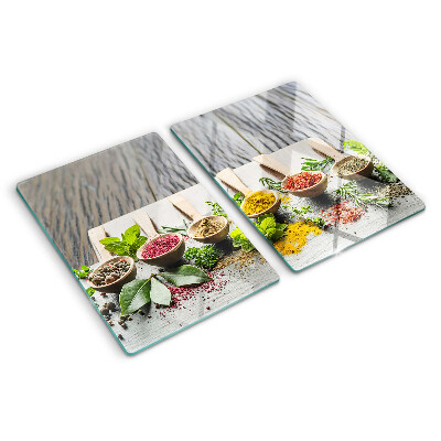 Glas-Schneidebrett mit Motiv aus Gewürzen und Kräutern
