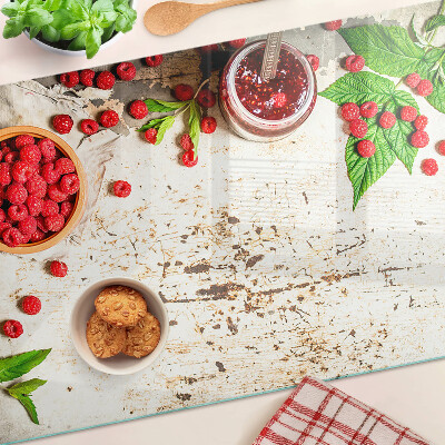 Glas schneidebrett Himbeeren und Blätter