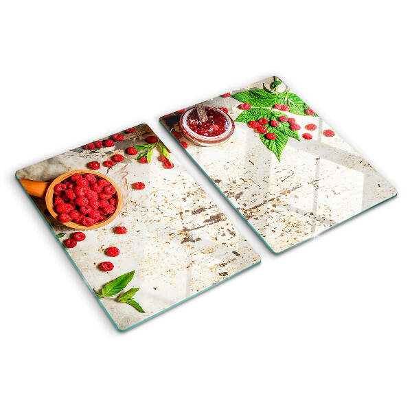Glas schneidebrett Himbeeren und Blätter