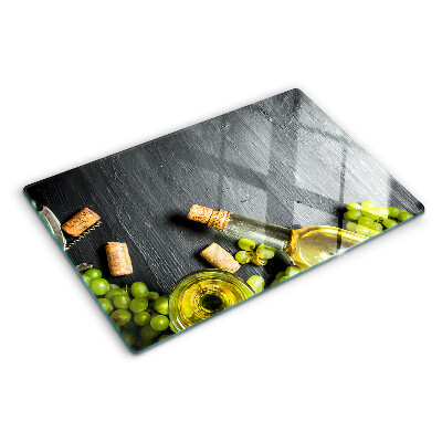Schneidebrett glas Wein und Trauben