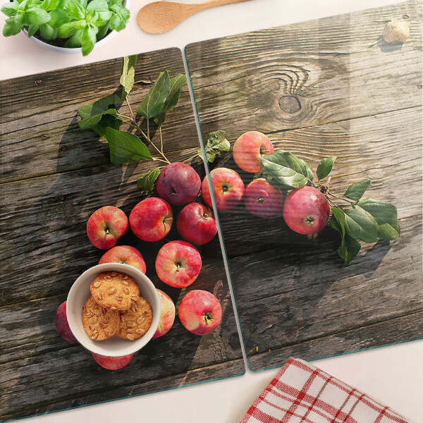 Glas schneidebrett Äpfel auf Holzgrund