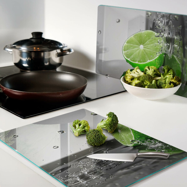 Glas-Schneidebrett mit Motiv von Zitronen im Wasser