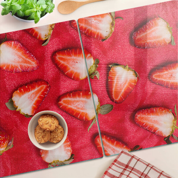 Glas-Schneidebrett mit Motiv von Erdbeeren auf rosa Hintergrund