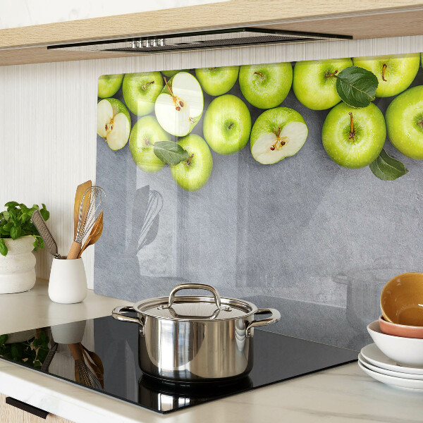 Schneidebrett mit Motiv grüne Äpfel auf grauem Untergrund