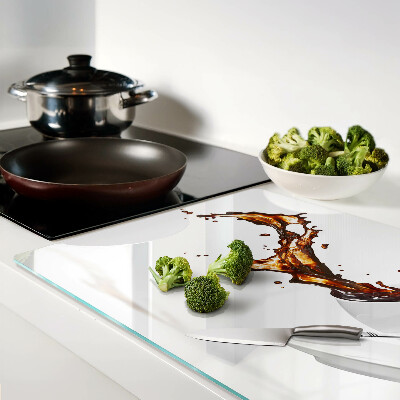 Schneidebrett Glas mit Kaffeefleck und Spritzgetränk