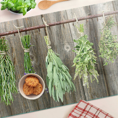 Glas schneidebrett Kräuter auf Holzgrund