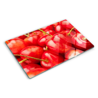 Schneidebrett mit Kirschmuster auf rotem Hintergrund