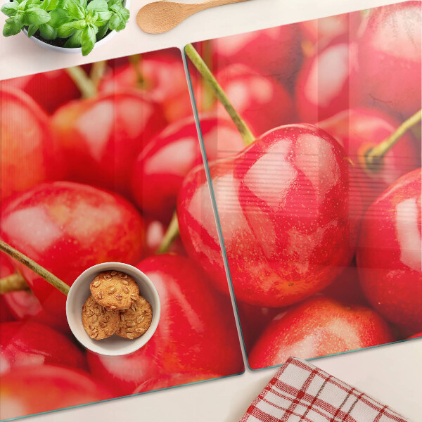 Schneidebrett mit Kirschmuster auf rotem Hintergrund