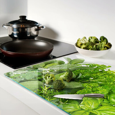 Glas-Schneidebrett mit grünem Kräuter- und Blättermotiv