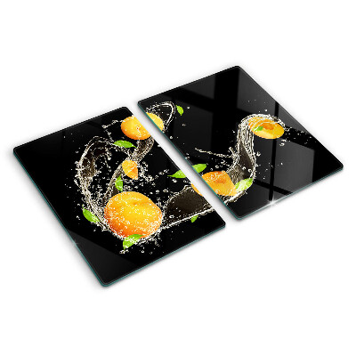 Glas schneidebrett Zitrusfrüchte in Wasser