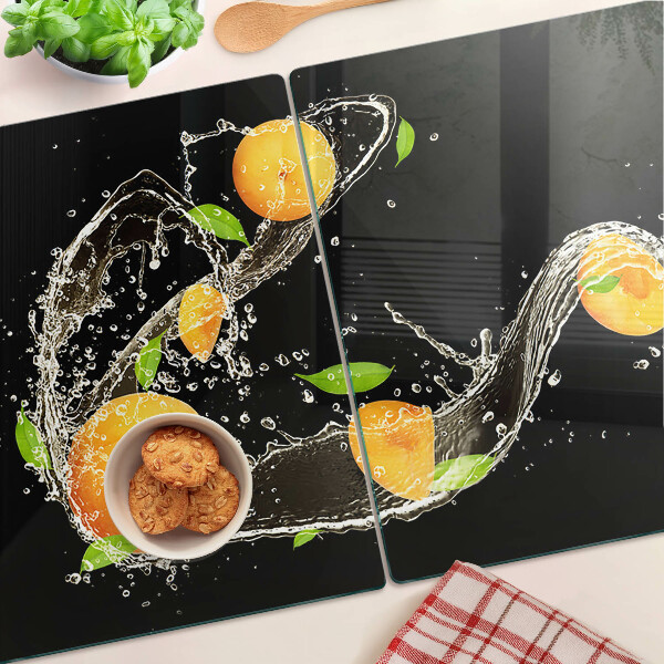 Glas-Schneidebrett mit Motiv aus Zitrusfrüchten im Wasser