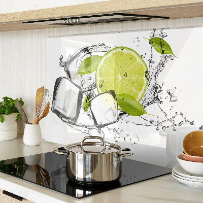 Glas-Schneidebrett mit Motiv einer Zitrone auf Eis und Blättern