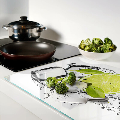 Glas schneidebrett Zitrone mit Eis und Blättern