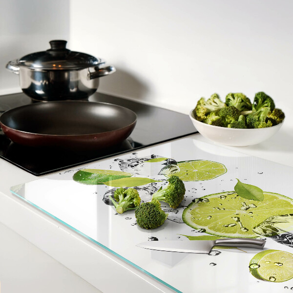 Schneidebrett Glas mit Motiv aus Zitronen und Eis im Wasser