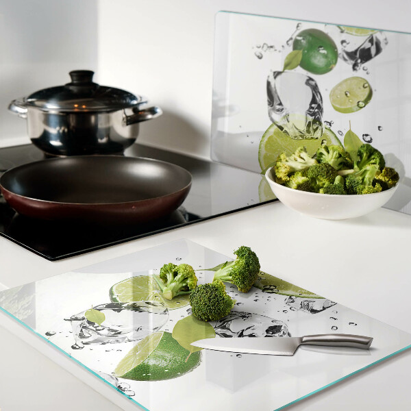 Schneidebrett Glas mit Motiv aus Zitronen und Eis im Wasser