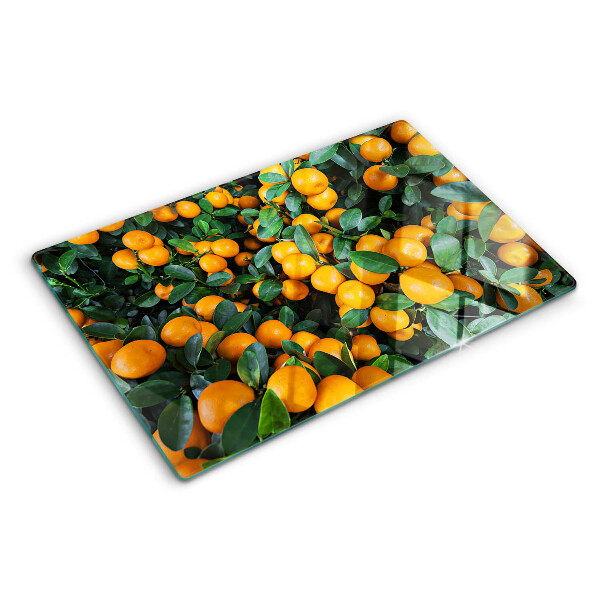 Glas schneidebrett Mandarinen an den Zweigen