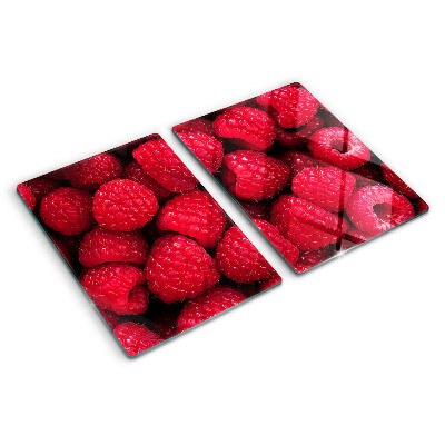 Schneidebrett glas Himbeeren im Hintergrund