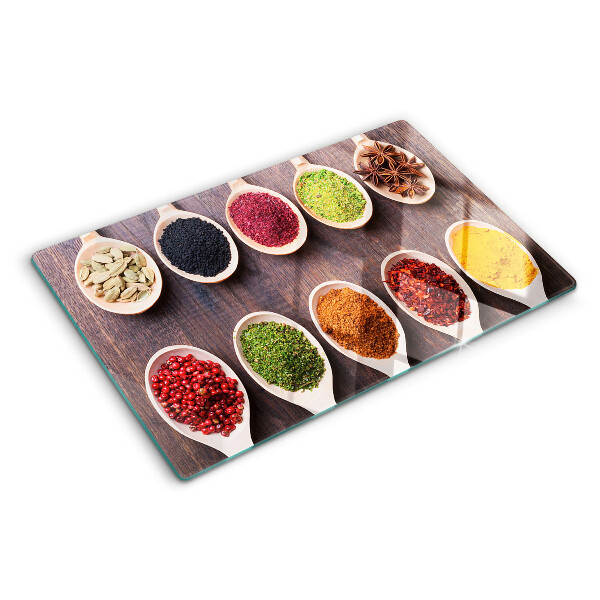 Schneidebrett glas Gewürze in Löffeln