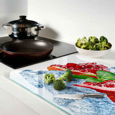 Glas-Schneidebrett mit Motiv aus Granatapfeln und Eisschollen